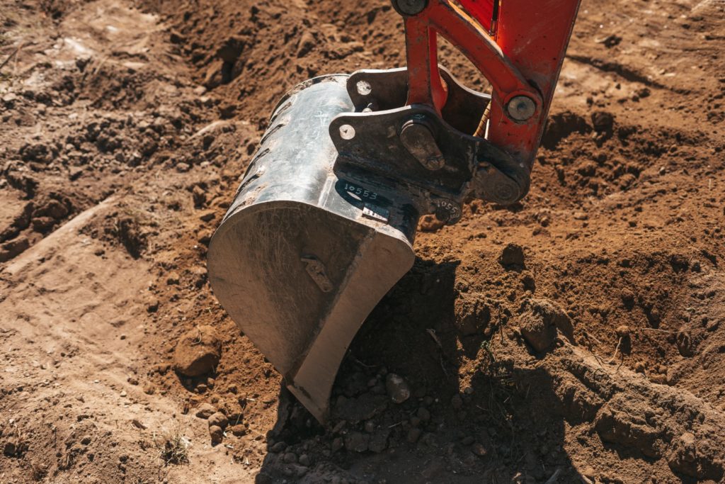 excavator-shovel-digging-on-dirt-2022-01-14-00-47-22-utc